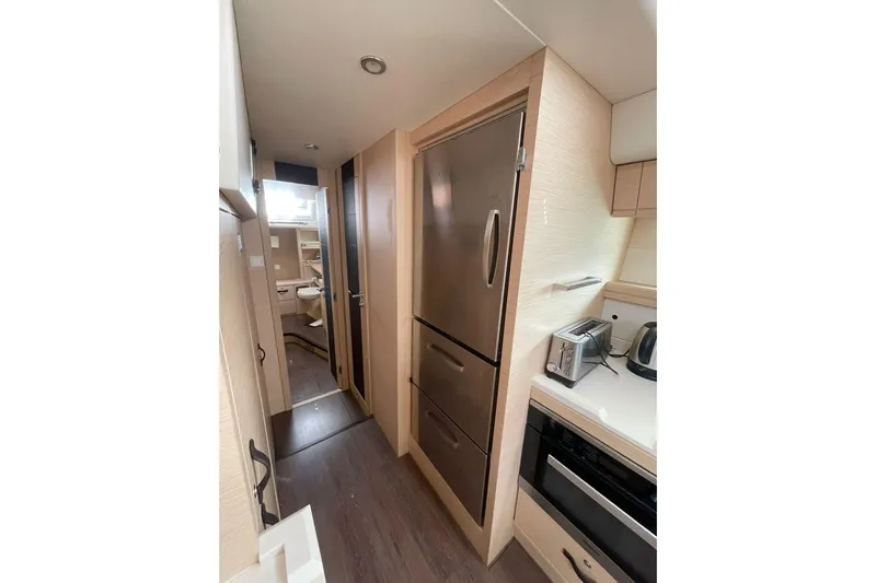  Yacht Photos Pics 2017 Jeanneau 64 yacht interior kitchen with modern appliances and sleek design.