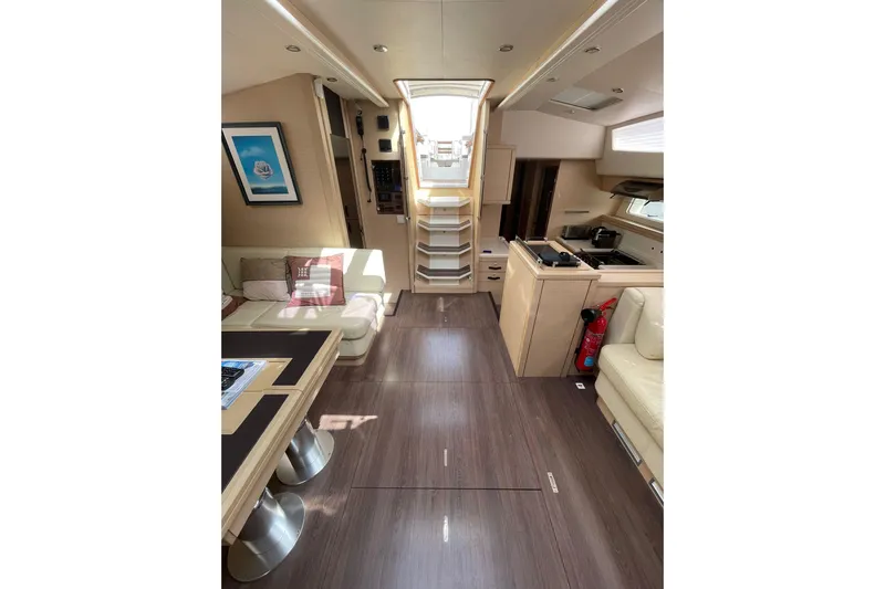 Yacht Photos Pics Luxurious interior of 2017 Jeanneau 64 yacht with modern kitchen and seating area.