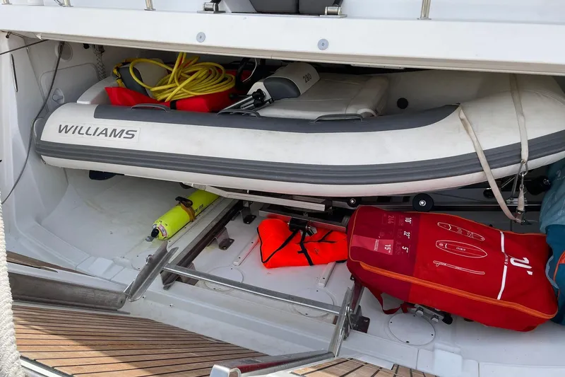 Yacht Photos Pics Storage compartment of a 2017 Jeanneau 64 yacht with inflatable boat and safety gear.