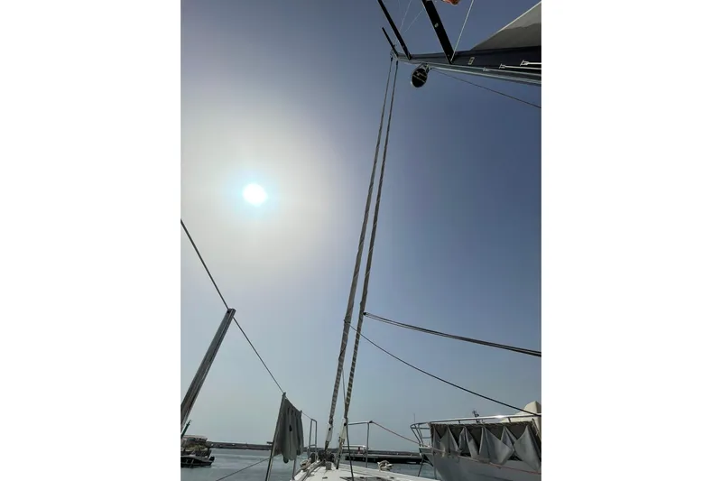  Yacht Photos Pics Jeanneau 64 sailboat mast under bright sun, clear sky, 2017 model.