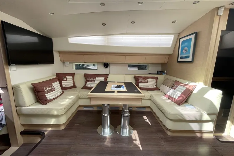  Yacht Photos Pics Luxurious interior of 2017 Jeanneau 64 yacht with elegant seating and modern decor.