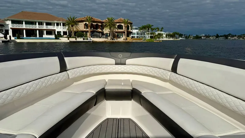  Yacht Photos Pics Luxury seating on a 2020 Fountain 43NX boat with waterfront view.