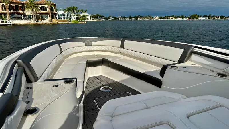  Yacht Photos Pics Luxury seating on a 2020 Fountain 43NX boat with scenic waterfront view.
