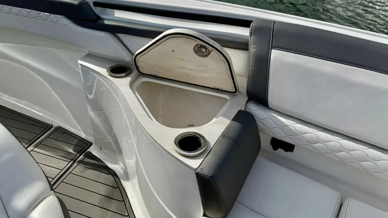  Yacht Photos Pics Luxury seating area on a 2020 Fountain 43NX boat with cup holders and storage.