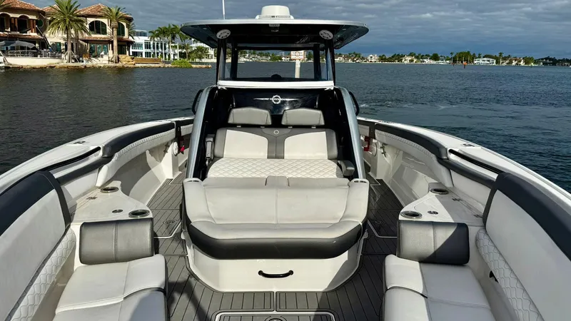  Yacht Photos Pics 2020 Fountain 43NX boat interior with luxurious seating on calm water.