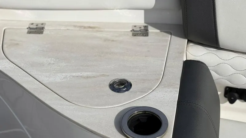  Yacht Photos Pics Interior detail of a 2020 Fountain 43NX boat, featuring a sleek cup holder and storage compartment.