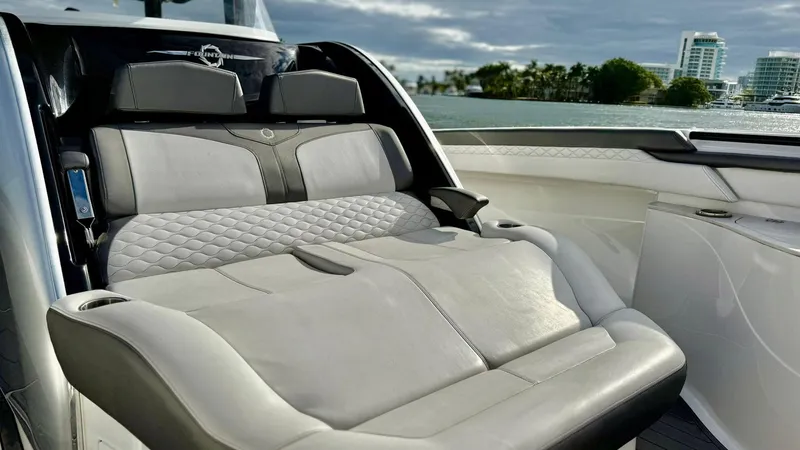  Yacht Photos Pics Luxurious seating on a 2020 Fountain 43NX boat with scenic waterfront view.
