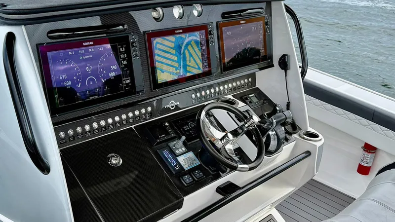  Yacht Photos Pics Control panel of 2020 Fountain 43NX boat with advanced navigation displays.