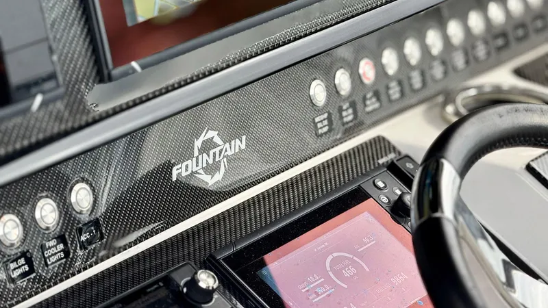  Yacht Photos Pics Dashboard of 2020 Fountain 43NX boat with control panel and steering wheel.