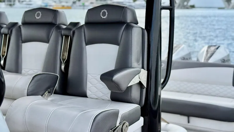  Yacht Photos Pics Luxury seating on a 2020 Fountain 43NX boat with stylish black and white upholstery.