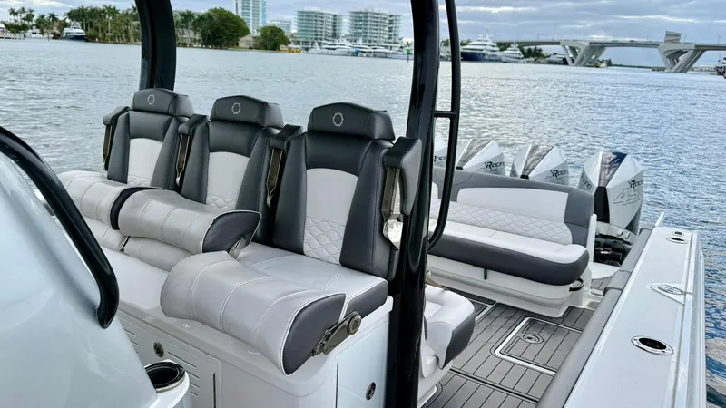  Yacht Photos Pics Luxury seating on a 2020 Fountain 43NX boat with scenic waterfront view.