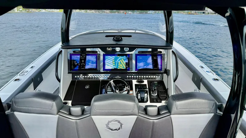  Yacht Photos Pics Cockpit of 2020 Fountain 43NX boat with advanced navigation displays on open water.