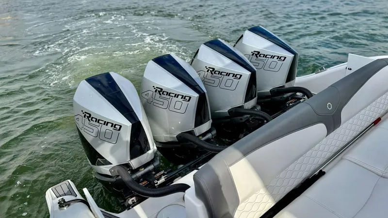  Yacht Photos Pics Four powerful outboard motors on a 2020 Fountain 43NX boat in water.