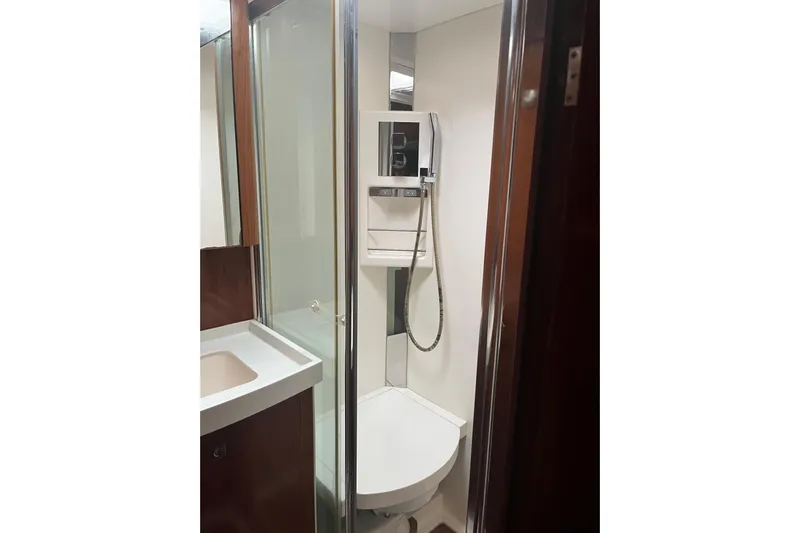  Yacht Photos Pics Compact bathroom in 2011 Amel 55 yacht with shower and sink.