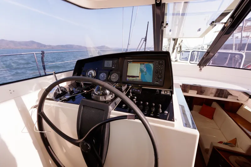  Yacht Photos Pics Cockpit of 2011 Amel 55 yacht with navigation equipment and steering wheel.