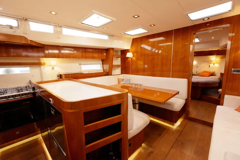  Yacht Photos Pics Luxurious interior of 2011 Amel 55 yacht with wood finishes and modern amenities.