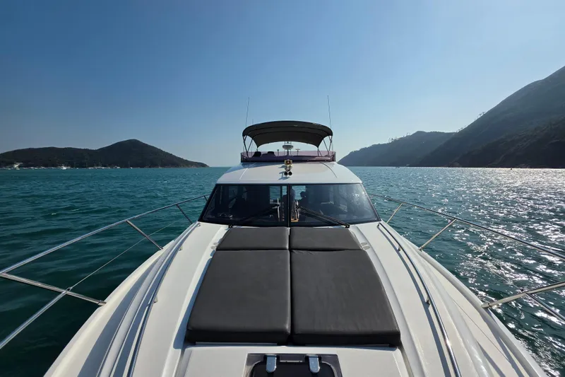  Yacht Photos Pics 2017 Princess 52 yacht cruising on serene blue waters with scenic mountain backdrop.