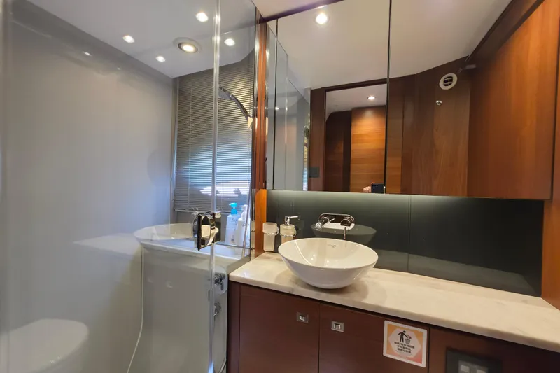  Yacht Photos Pics Luxurious bathroom interior of 2017 Princess 52 yacht with modern fixtures and elegant design.