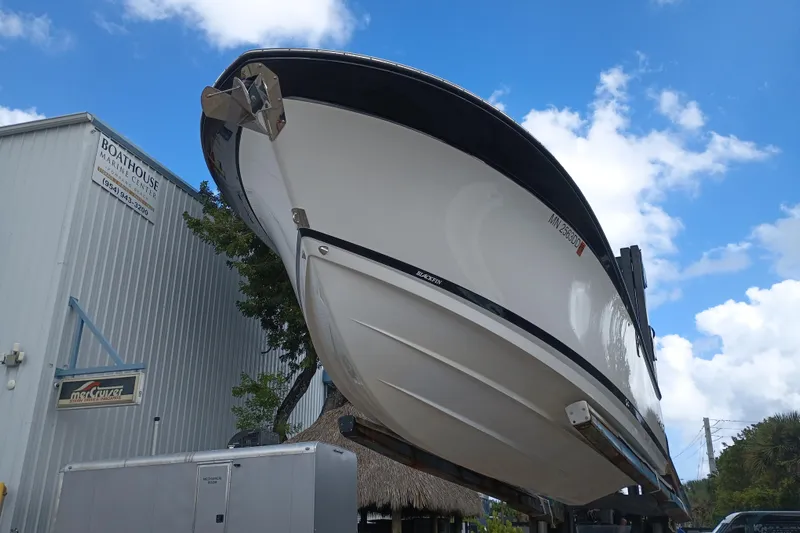  Yacht Photos Pics 2020 Blackfin 272 CC boat at Boathouse Marine Center under blue sky.