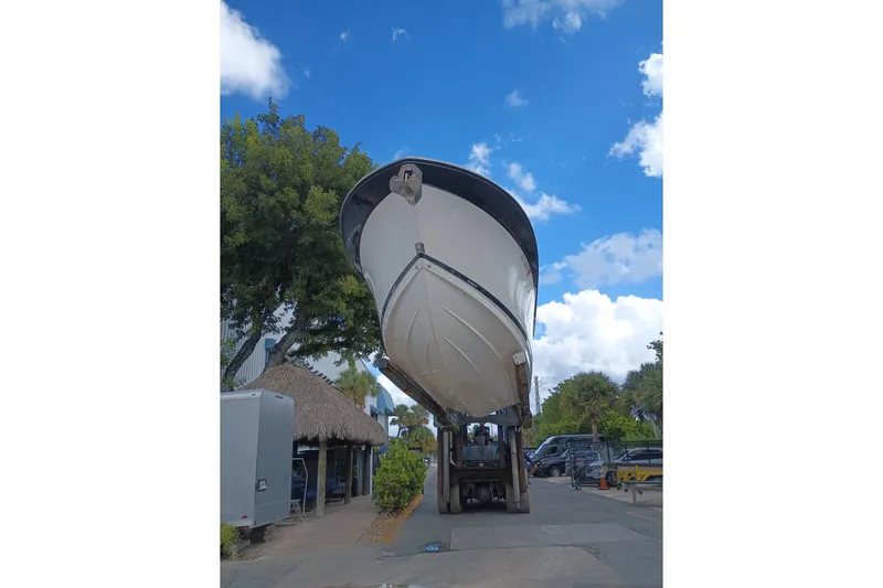  Yacht Photos Pics 2020 Blackfin 272 CC boat on forklift under blue sky.