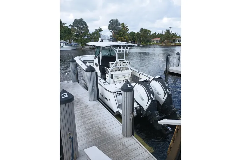  Yacht Photos Pics 2020 Blackfin 272 CC boat docked with twin outboard engines.