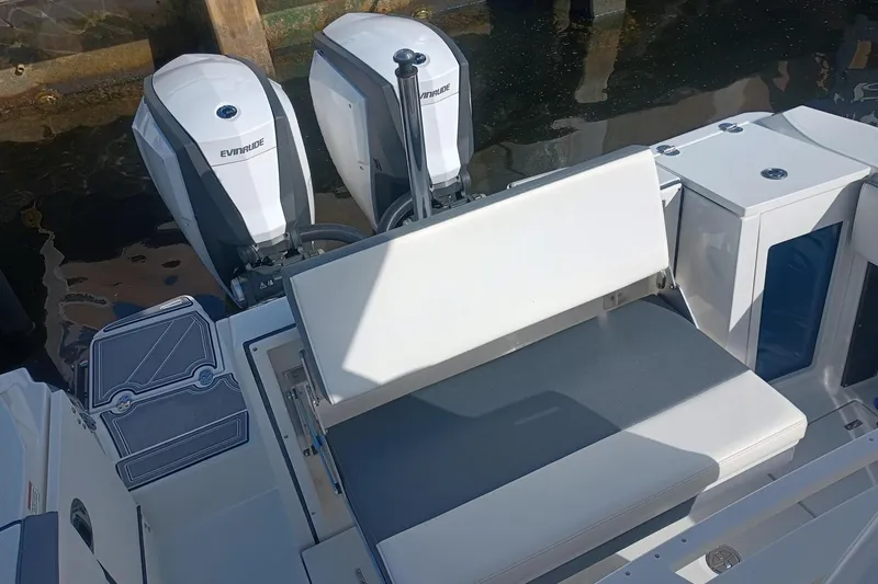  Yacht Photos Pics 2020 Blackfin 272 CC boat with dual Evinrude engines and seating area.