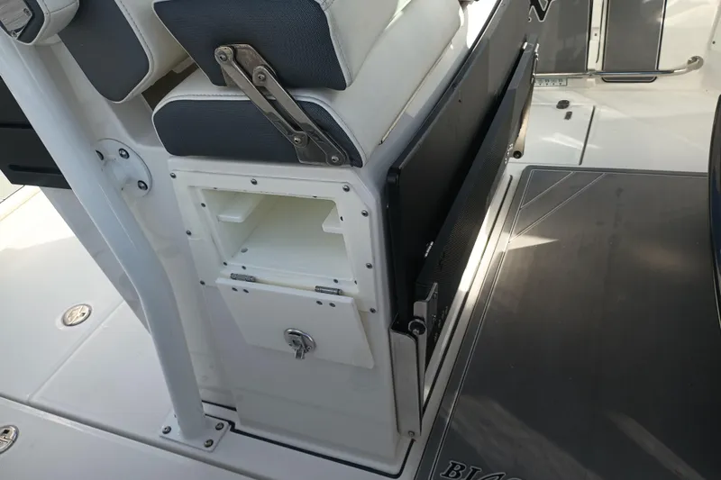  Yacht Photos Pics 2020 Blackfin 272 CC boat interior with storage compartment and seating.