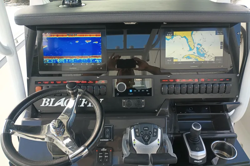 Yacht Photos Pics 2020 Blackfin 272 CC boat dashboard with Garmin displays and steering wheel.