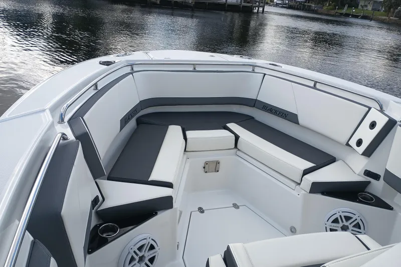  Yacht Photos Pics 2020 Blackfin 272 CC boat interior with cushioned seating and cup holders.