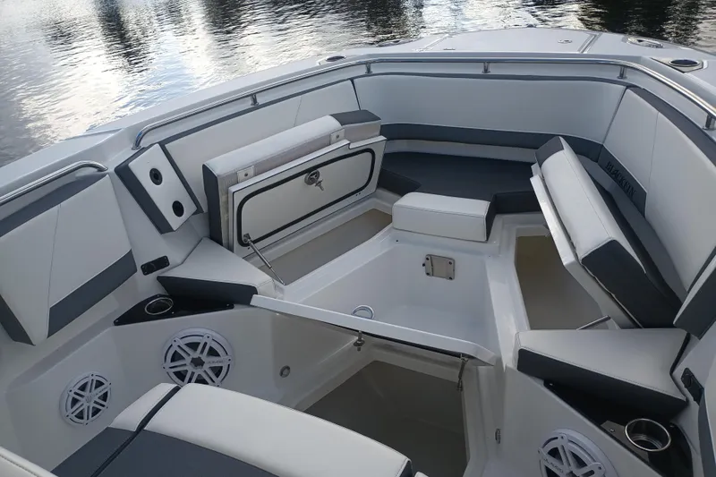  Yacht Photos Pics 2020 Blackfin 272 CC boat interior with cushioned seating and storage compartments.