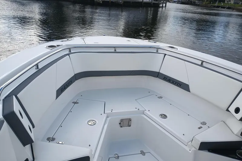  Yacht Photos Pics 2020 Blackfin 272 CC boat interior with sleek seating and storage compartments.