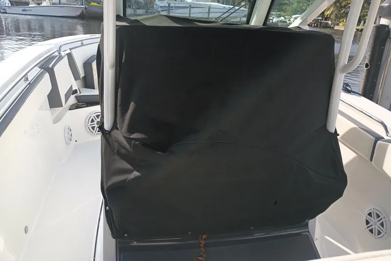  Yacht Photos Pics 2020 Blackfin 272 CC boat interior with covered console and seating area.