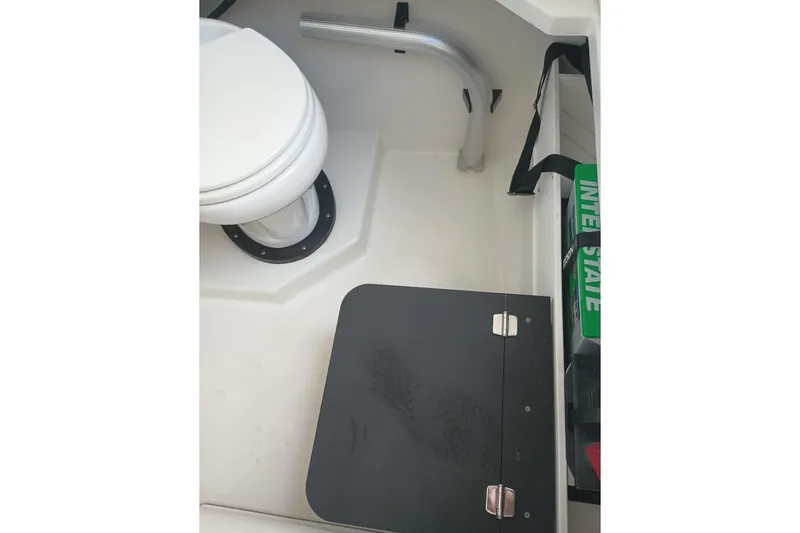 Yacht Photos Pics 2020 Blackfin 272 CC boat interior with toilet and storage compartment.