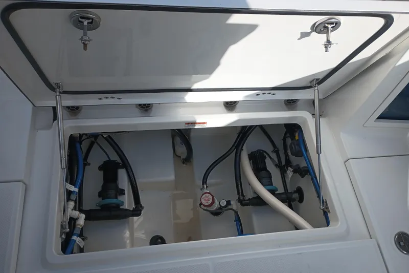  Yacht Photos Pics 2020 Blackfin 272 CC boat compartment with visible wiring and plumbing.