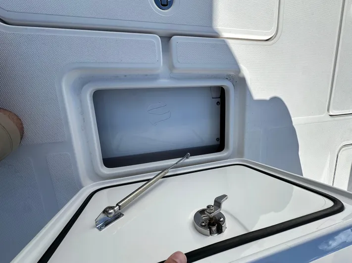 Troublemaker Yacht Photos Pics 2020 Invincible 39 Open Fisherman storage compartment with open hatch and latch.
