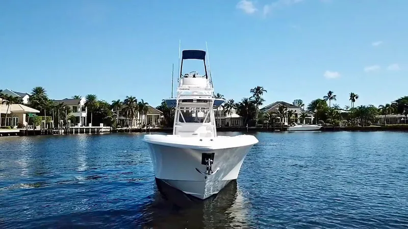Troublemaker Yacht Photos Pics 2020 Invincible 39 Open Fisherman boat on calm water, front view.