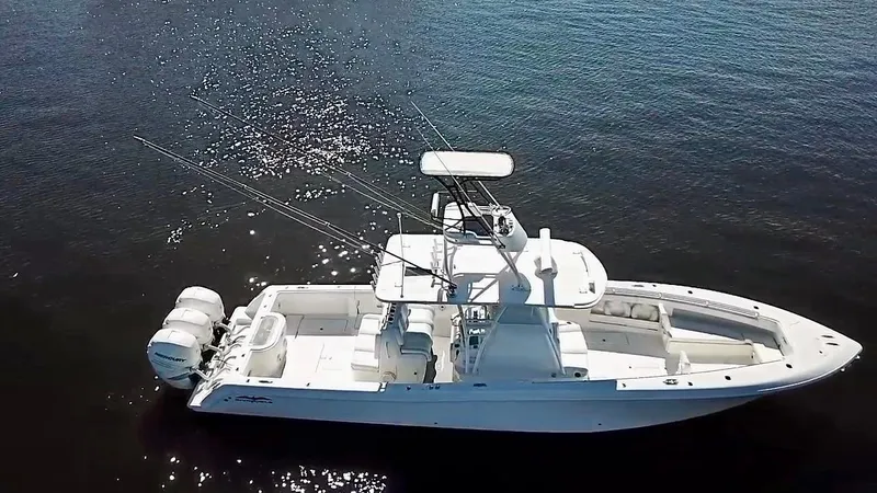 Troublemaker Yacht Photos Pics 2020 Invincible 39 Open Fisherman boat on calm water, aerial view.