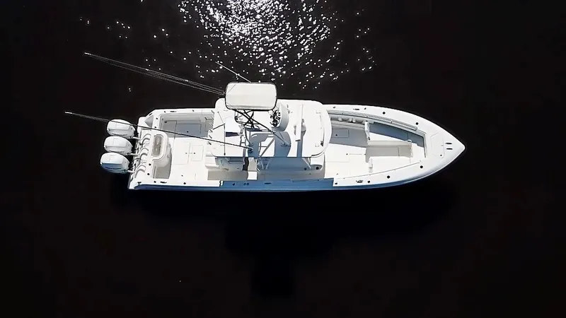 Troublemaker Yacht Photos Pics Aerial view of 2020 Invincible 39 Open Fisherman boat on dark water.