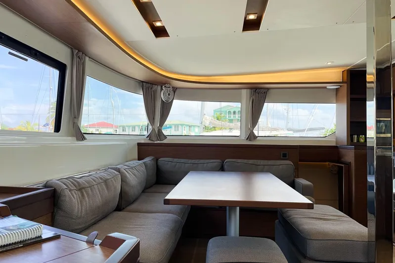 Spanky's Gang Yacht Photos Pics Interior of 2021 Lagoon 46 yacht with modern seating and large windows.