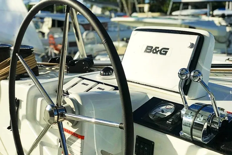 Spanky's Gang Yacht Photos Pics Steering wheel and controls of a 2021 Lagoon 46 catamaran with B&G navigation system.