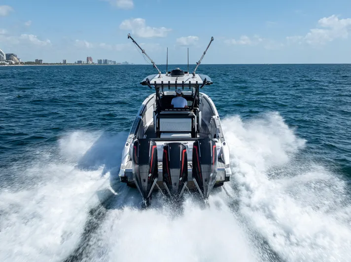  Yacht Photos Pics 2022 Nor-Tech 390 Sport Center Console speeding on open water.