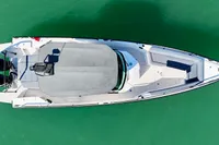 Top view of 2020 Axopar 28 T-Top boat on turquoise water.