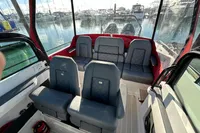 2020 Axopar 28 T-Top boat interior with gray seating, docked at marina.