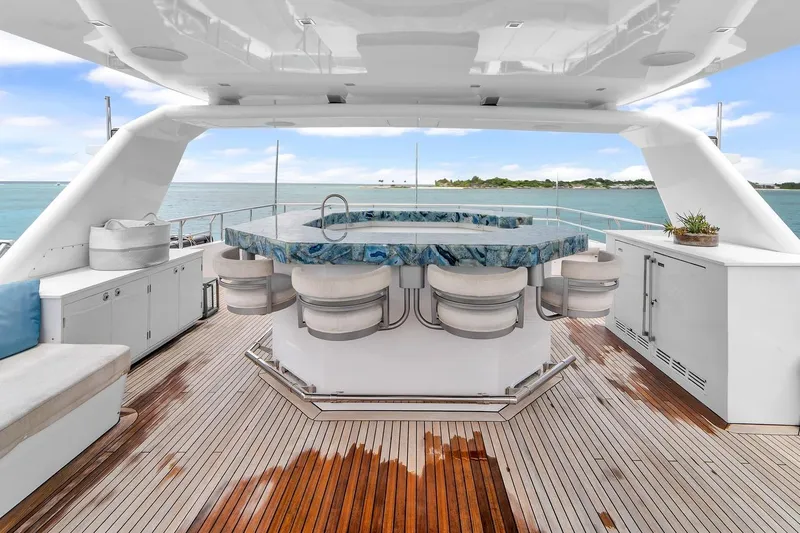 Sea Axis Yacht Photos Pics Luxurious 1988 Heesen Trideck yacht with elegant outdoor bar and ocean view.