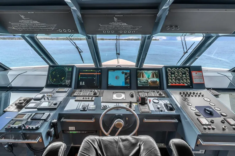 Sea Axis Yacht Photos Pics Bridge of 1988 Heesen Trideck yacht with advanced navigation controls and panoramic sea view.