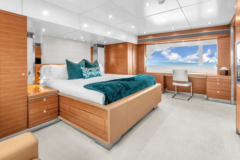Sea Axis Yacht Photos Pics Luxurious bedroom interior on 1988 Heesen Trideck yacht with ocean view.