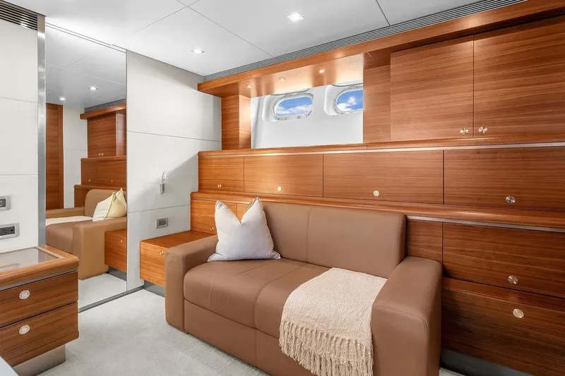 Sea Axis Yacht Photos Pics Luxurious interior of 1988 Heesen Trideck yacht with elegant wood paneling and cozy seating.