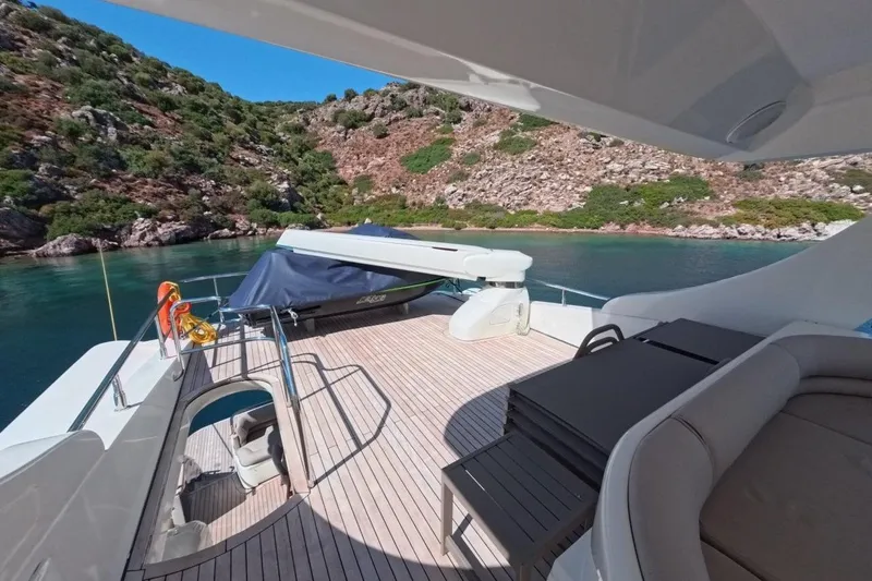  Yacht Photos Pics Luxurious 2005 Princess 25M yacht deck with scenic coastal view.