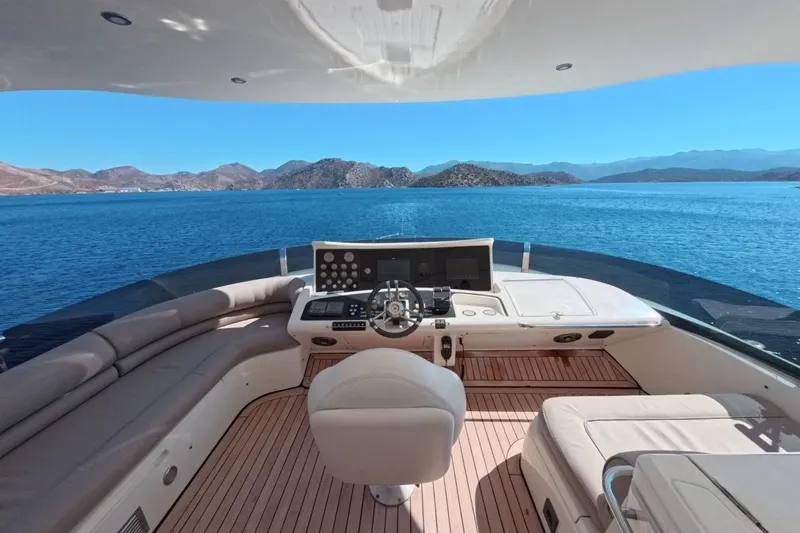  Yacht Photos Pics Luxurious 2005 Princess 25M yacht helm with stunning ocean view and modern controls.