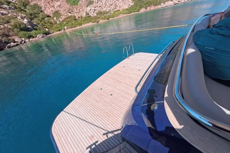  Yacht Photos Pics Luxury yacht Princess 25M, 2005 model, docked in serene turquoise waters.